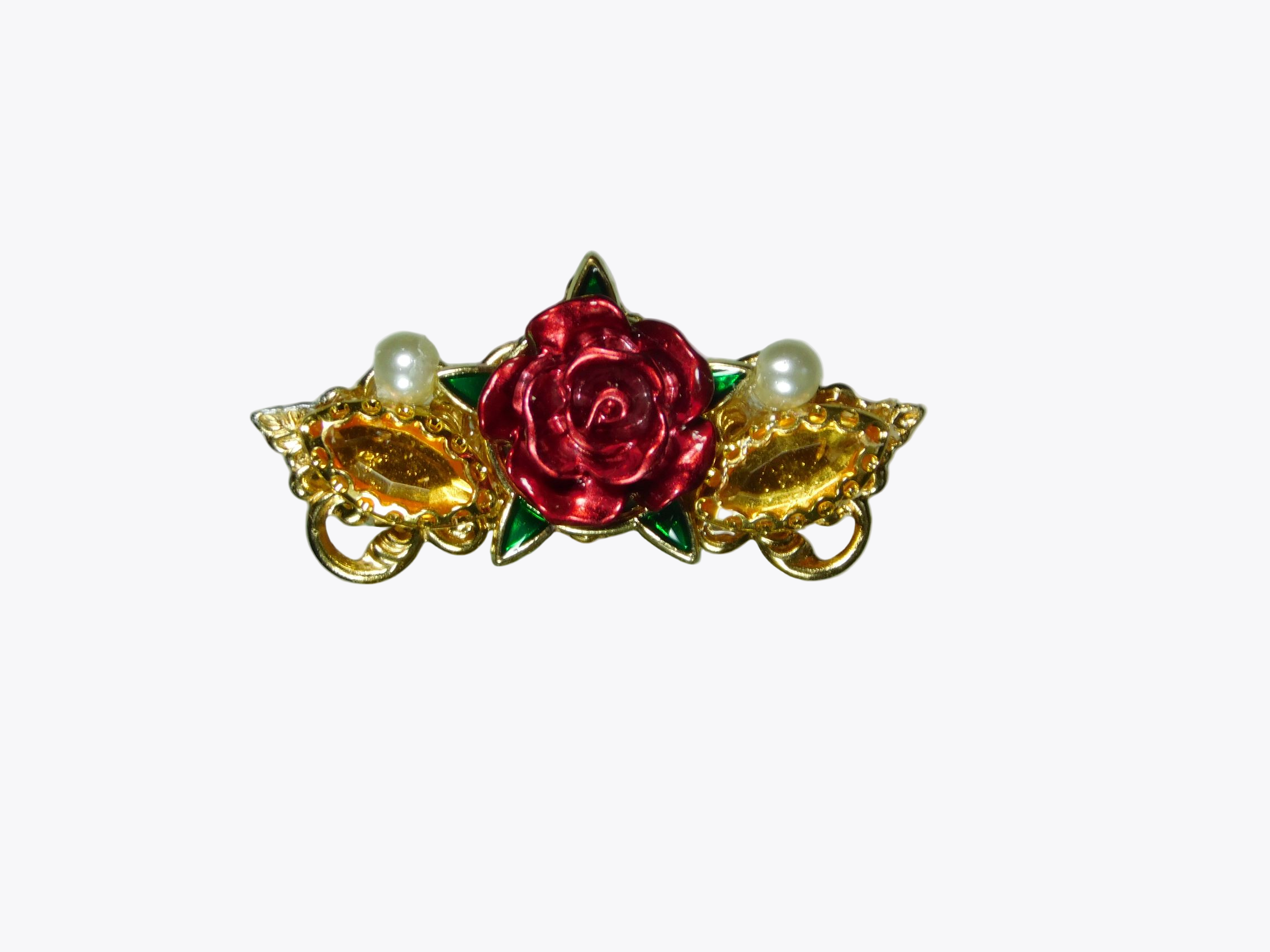 large center  rose with five green leaves and a gold colored horse eye rhinestone and small white pearl on either side of the rose