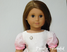 Load image into Gallery viewer, 18 inch doll shown wearing the Silver and Beige Cameo Brooch

