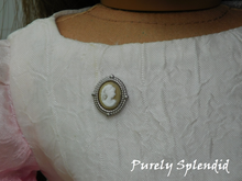 Load image into Gallery viewer, Cameo Brooch shown on the dress of an 18 inch doll
