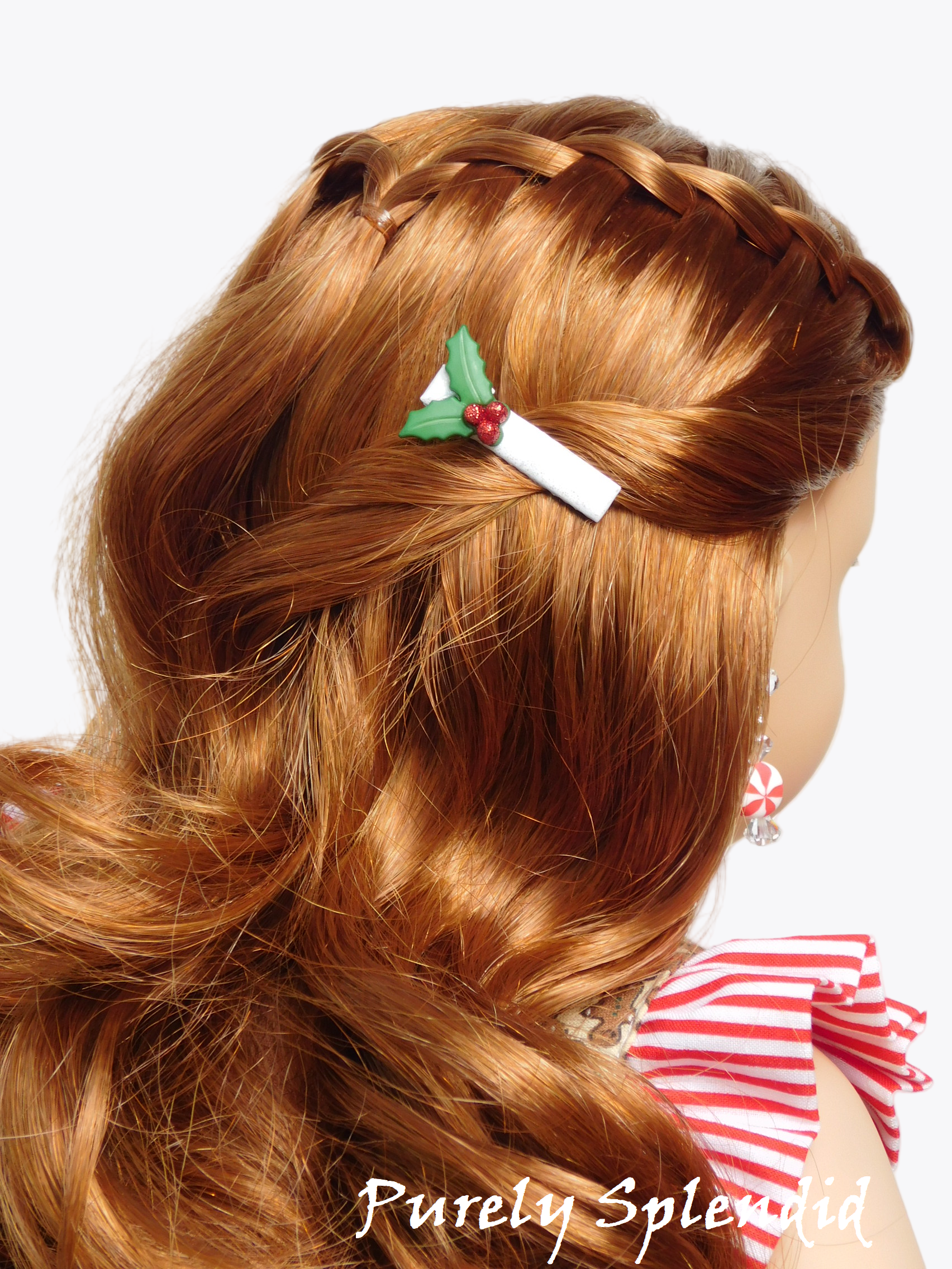 holly and berries on a white hair clip worn by an 18 inch doll