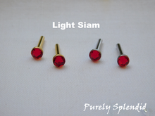 Load image into Gallery viewer, Light Siam 2mm Stud Earrings in either silver or gold base
