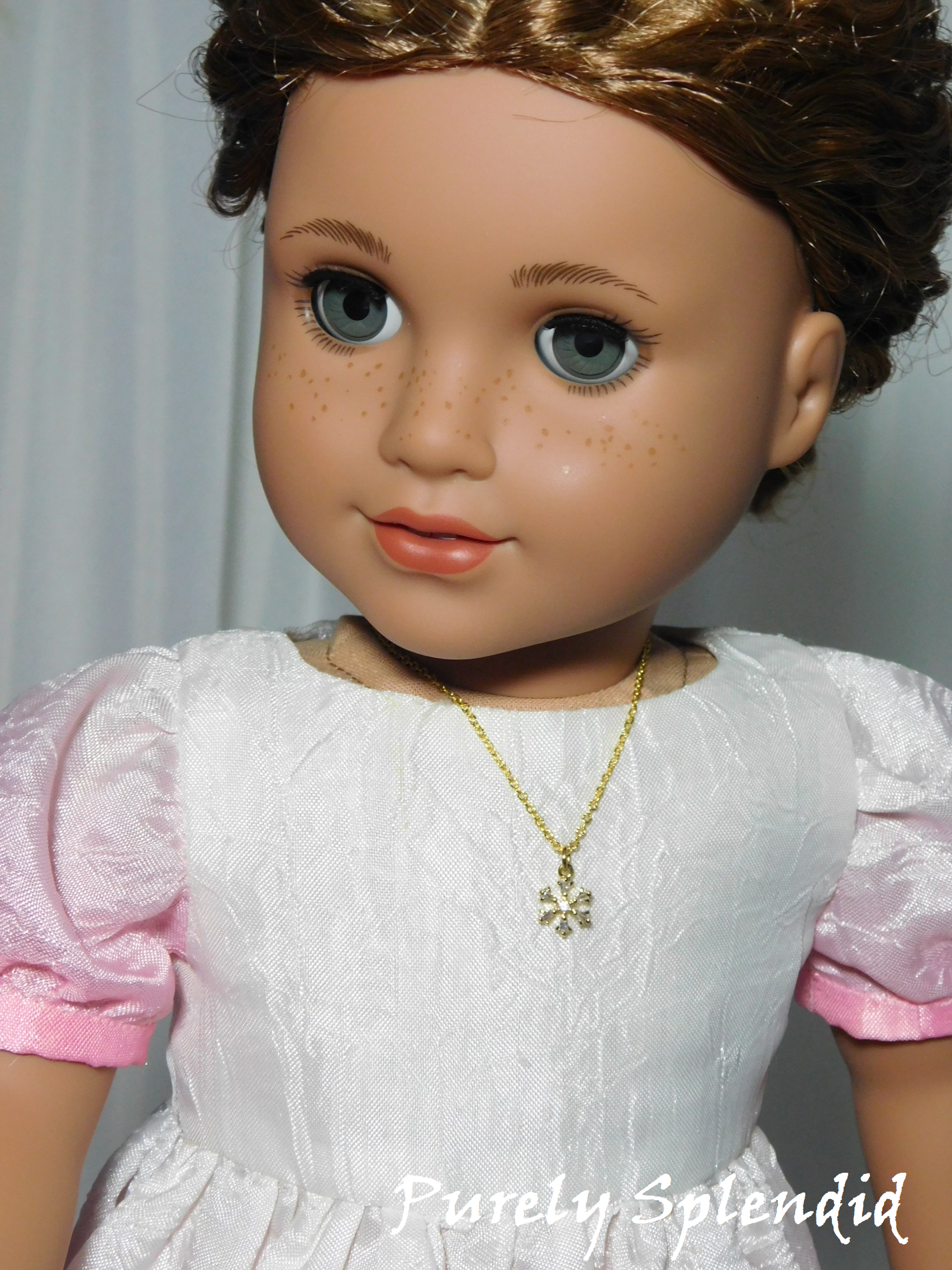 18 inch doll wearing a Gold Snowflake Necklace