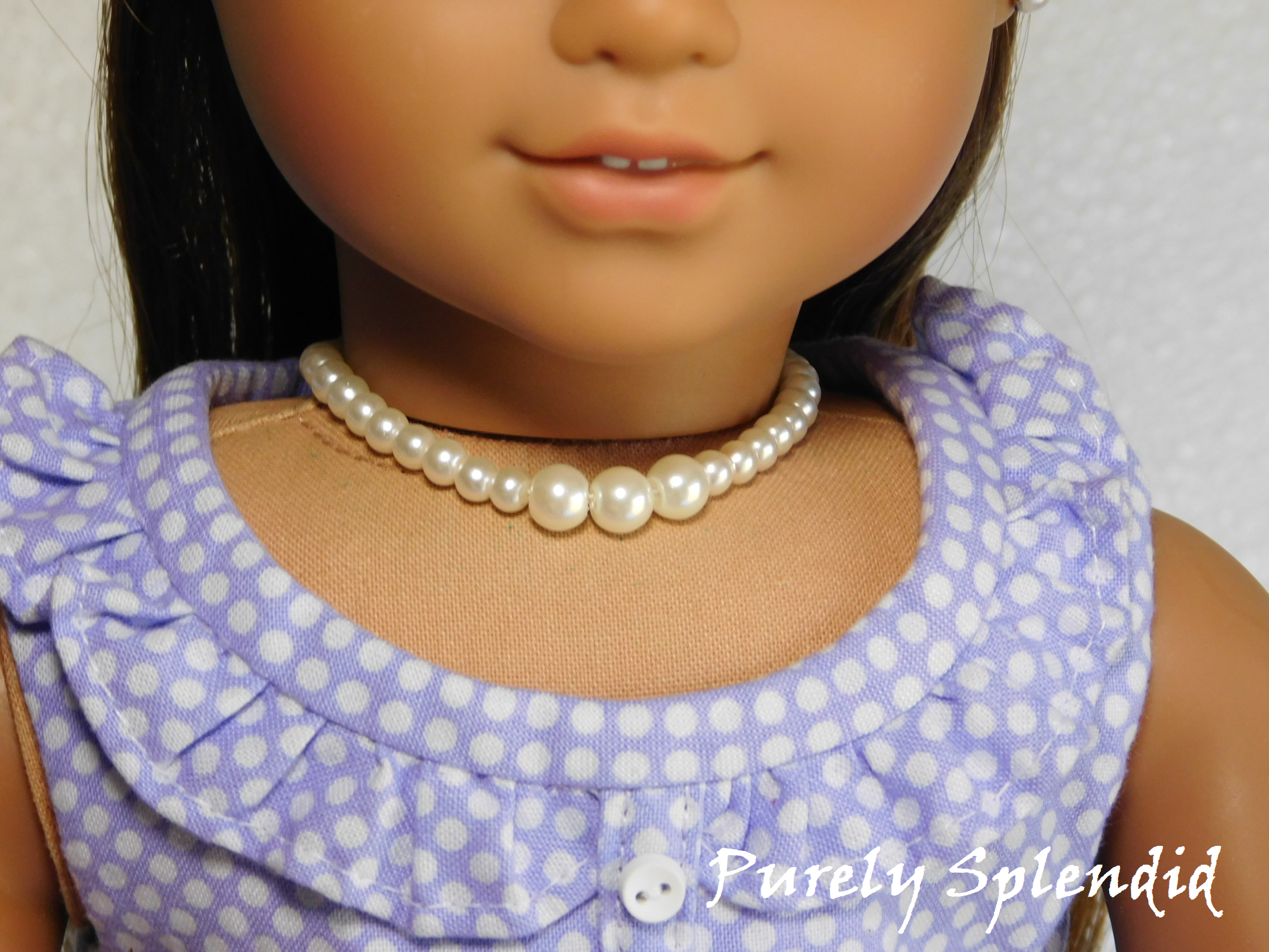 18 inch doll wearing a White Graduated Pearl Necklace