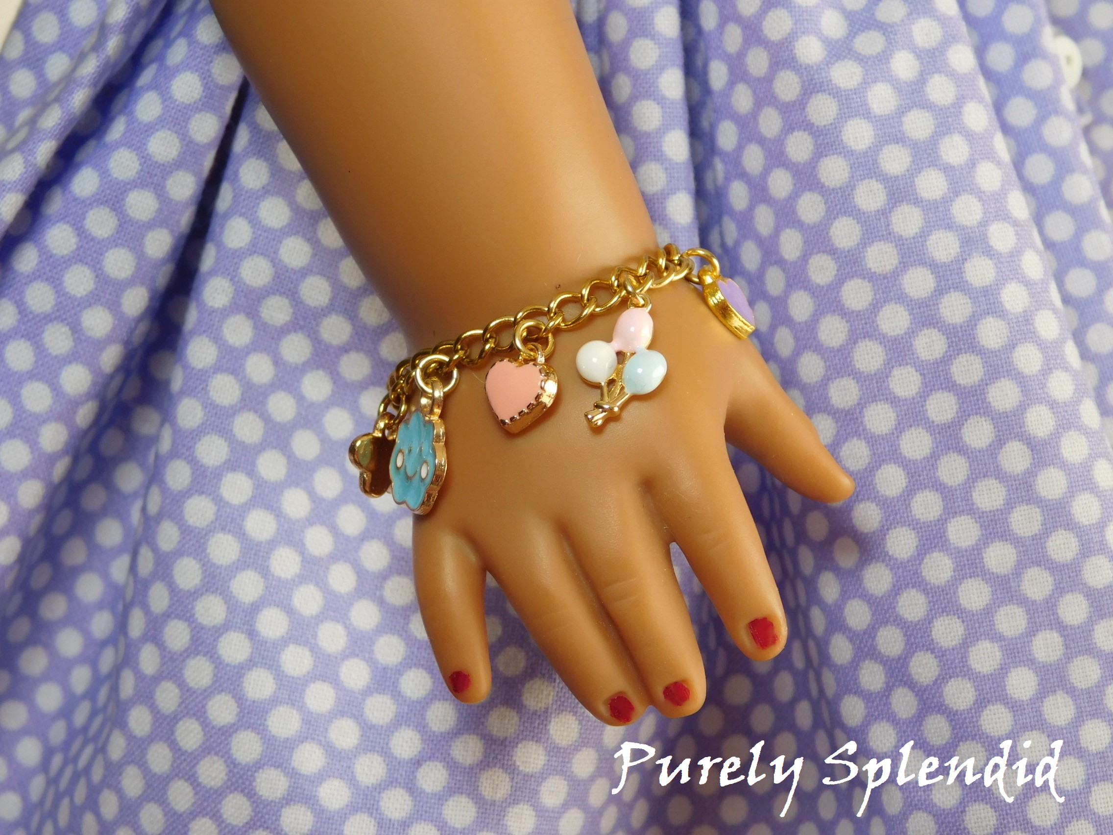 18 inch doll shown wearing a Happy Charm Bracelet with a bunch of balloons, pink heart and blue happy cloud charm