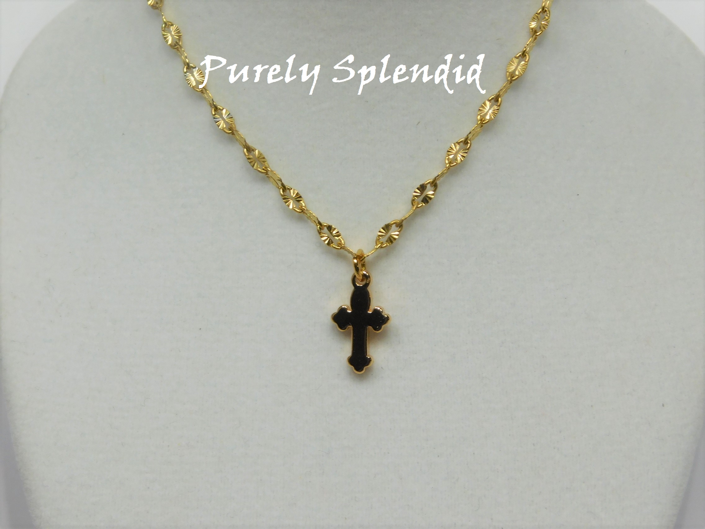 A Simple Gold Cross on a decorative gold chain