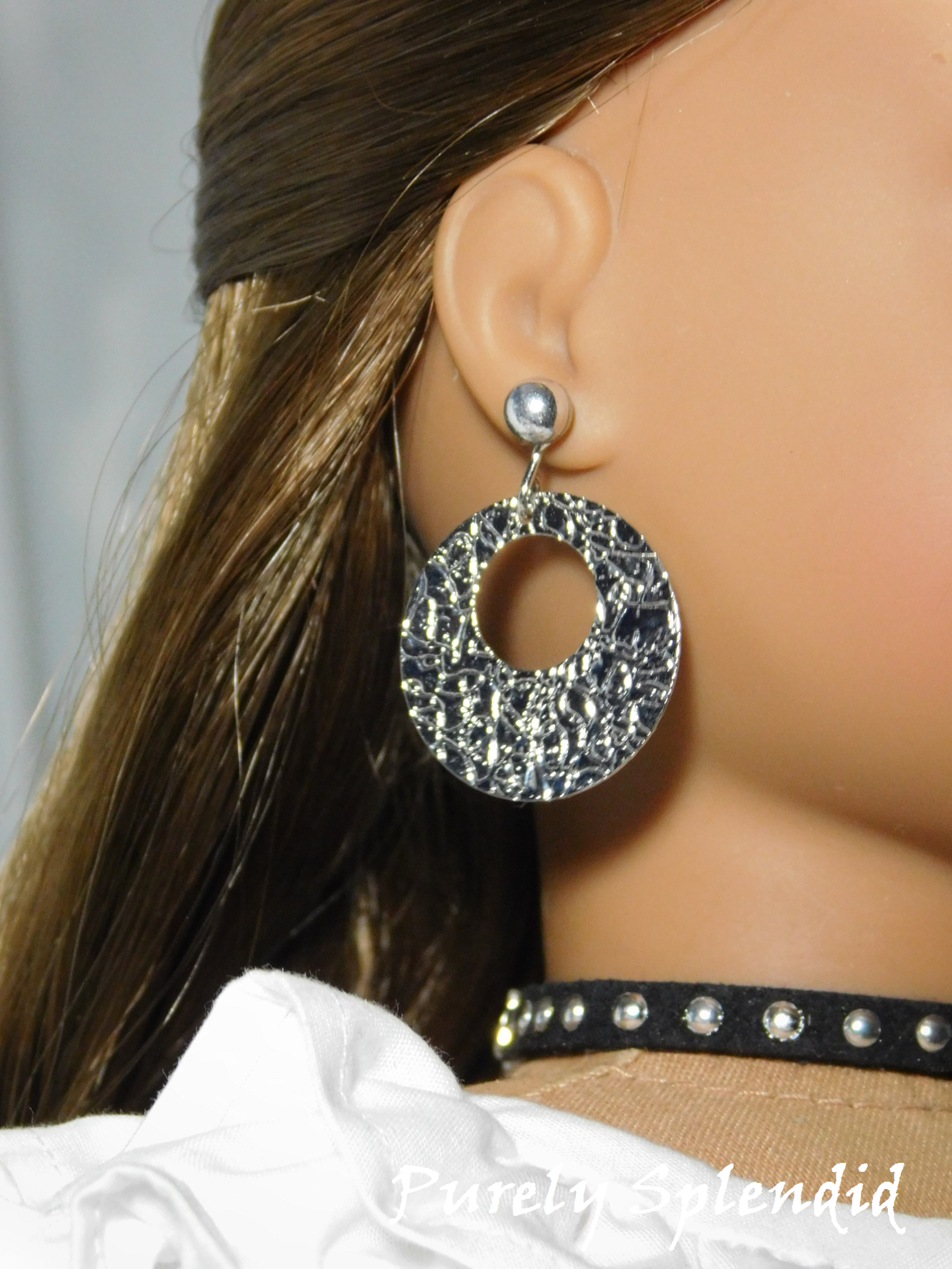 Silver Textured Flat Hoop Earrings shown worn by an 18 inch doll along with a pair of Silver Small Classic Studs
