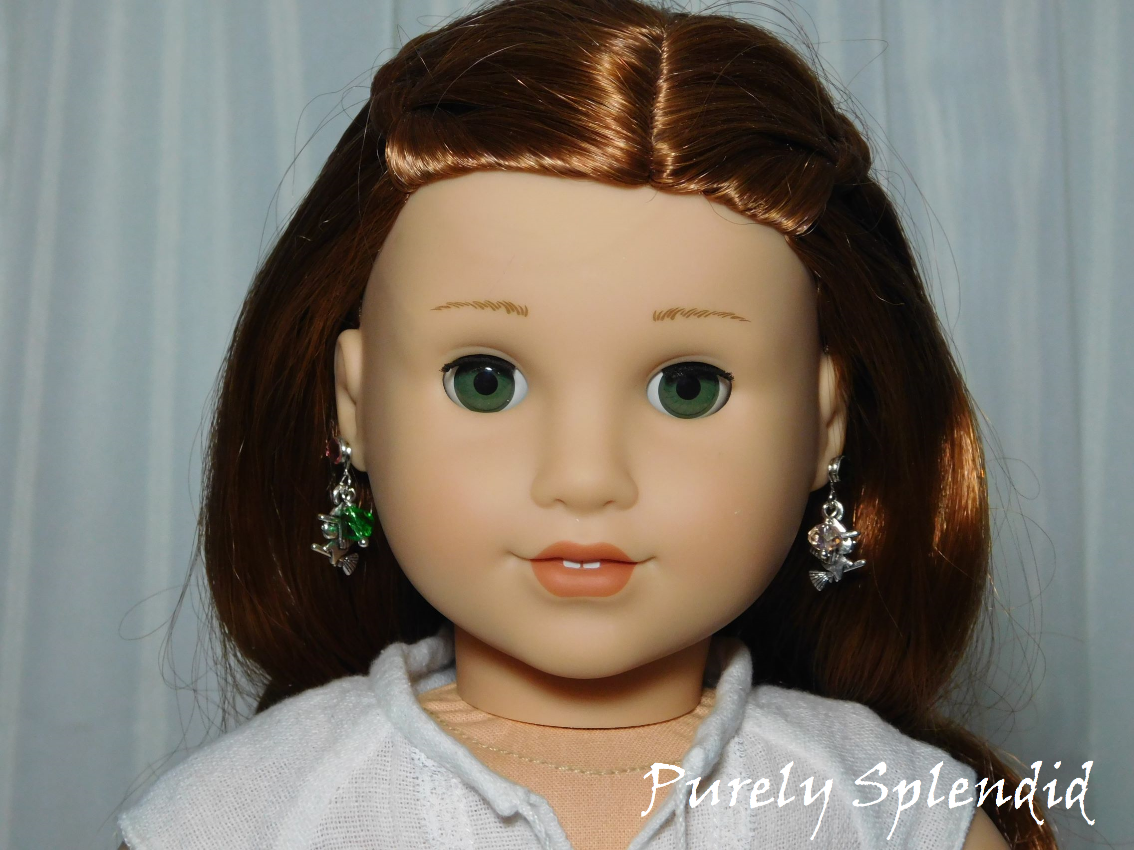 18 inch doll shown wearing a pair of Witch Earrings