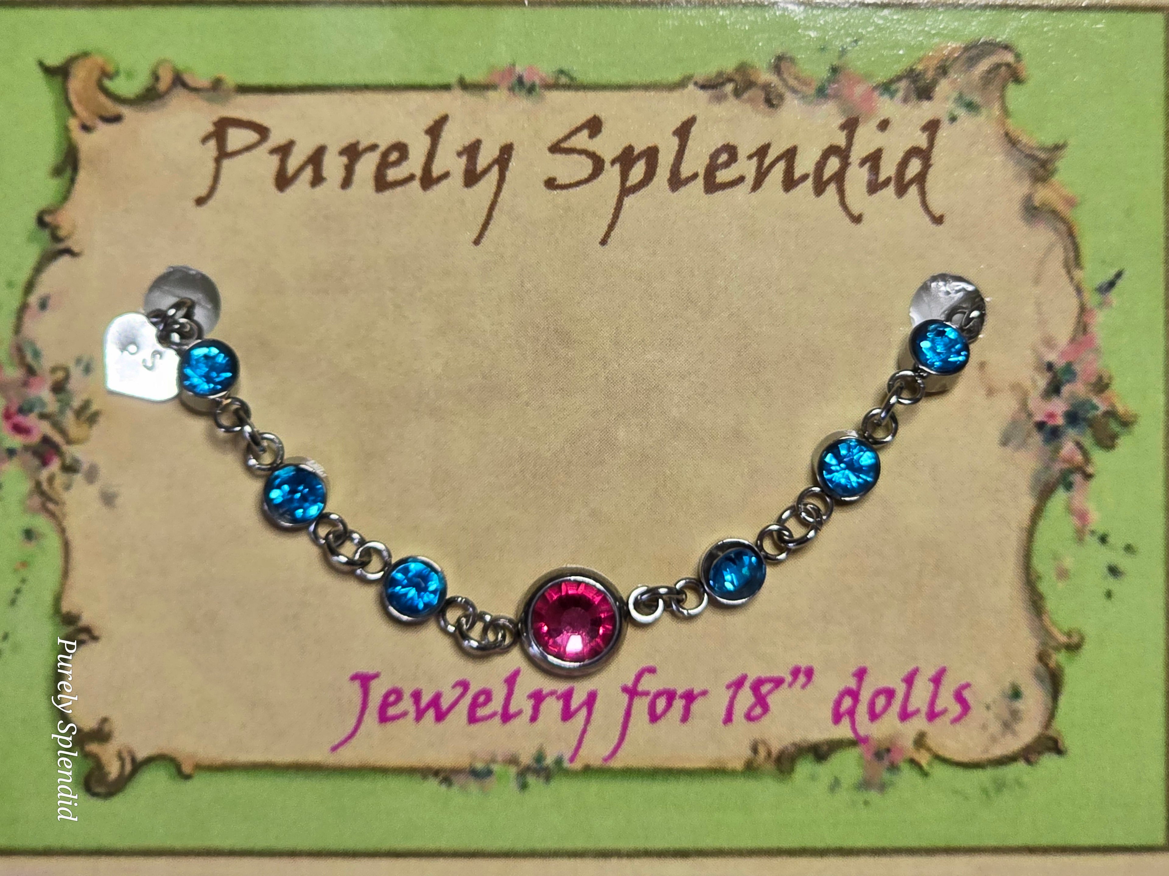 Dark Pink center stone surrounded by Baby Blue stones