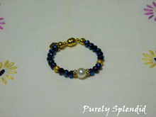 Load image into Gallery viewer, Beautiful Sapphire Blue Crystal beads make this Crystal Evening Bracelet look lovely! A large white pearl flanked by a ring of sparkle is the focal point.
