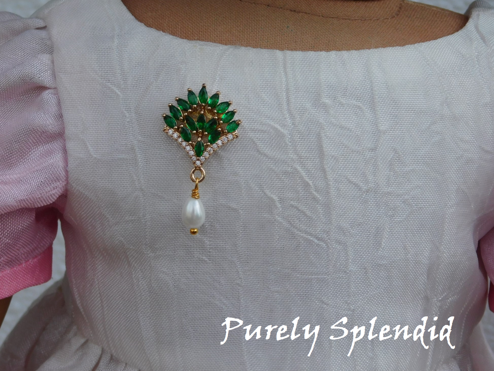 Dazzling Fan Brooch in green with teardrop pearl dangle. Shown worn by an 18 inch doll