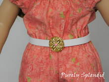 Load image into Gallery viewer, White belt approximately 1/2 inch wide with a large flat gold ornamental buckle which has a light pink center crystal shown on an 18 inch doll
