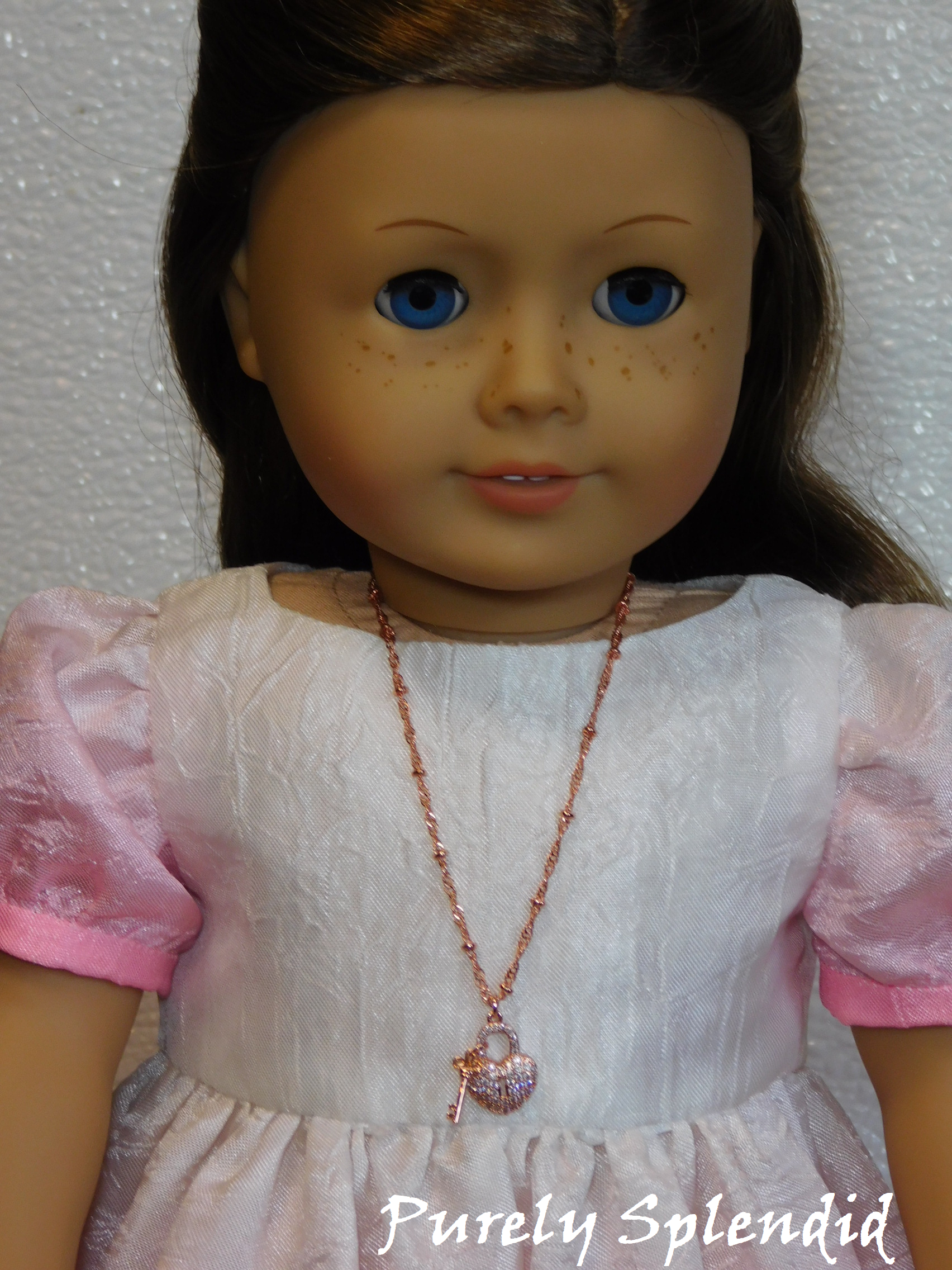 18 inch doll shown wearing a Rose Gold Heart Lock and Key Necklace