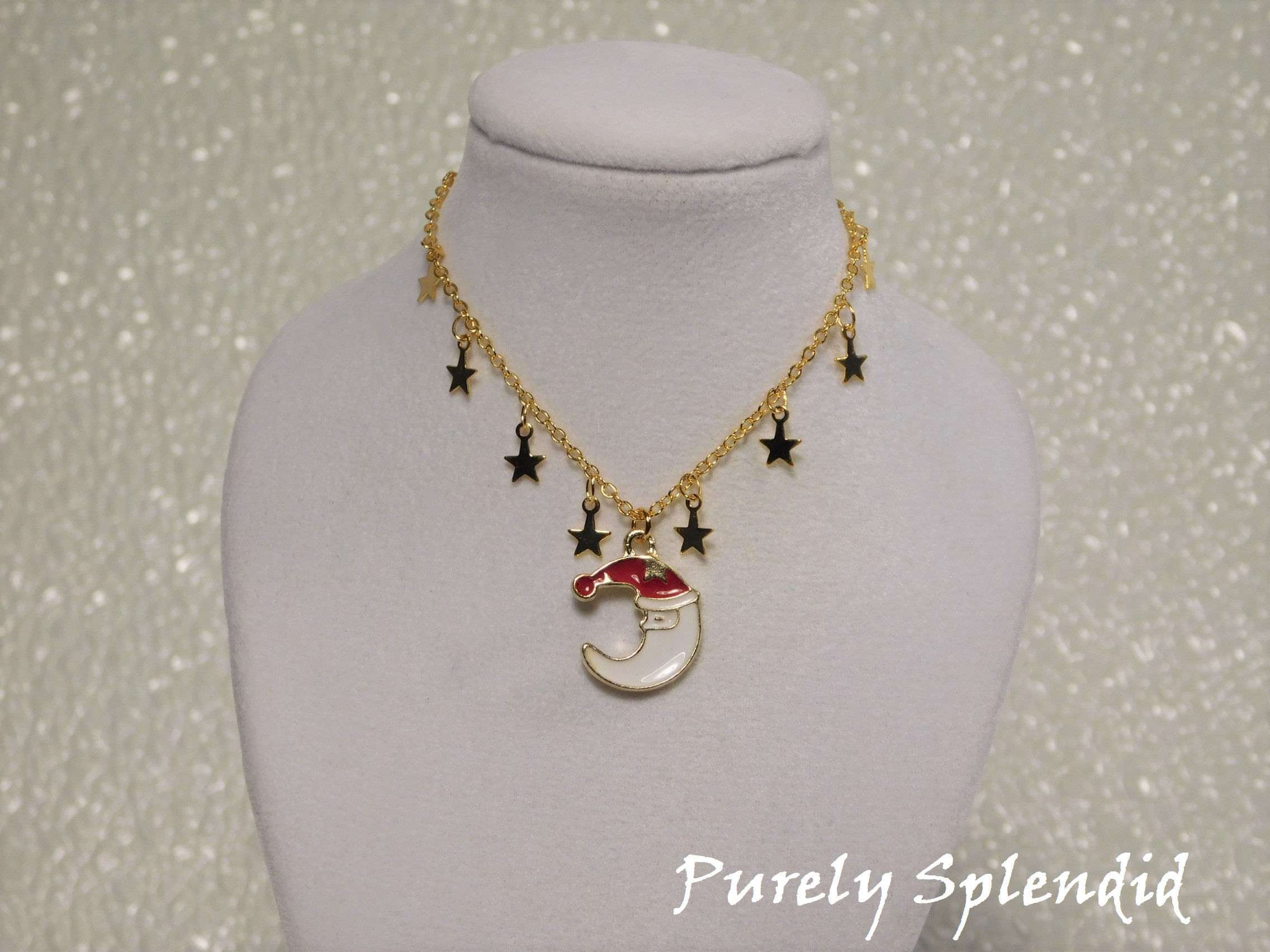 Cute Santa Moon charm on a gold chain that has mini gold star charms