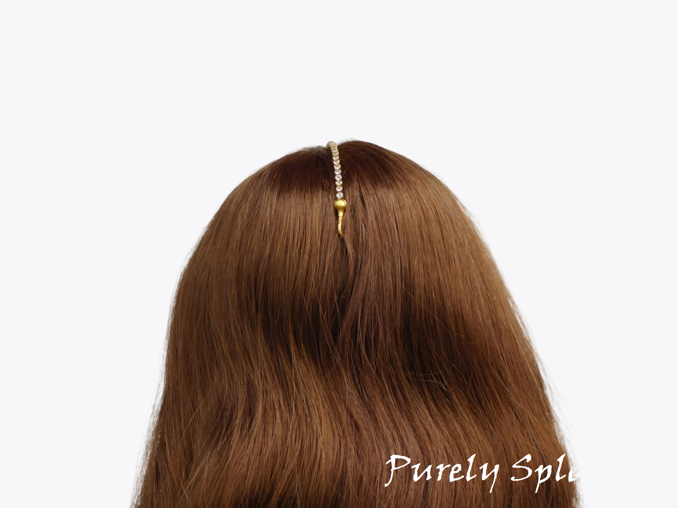 18 inch doll shown with the Maang Tikka hooked into her hair in the back of her head
