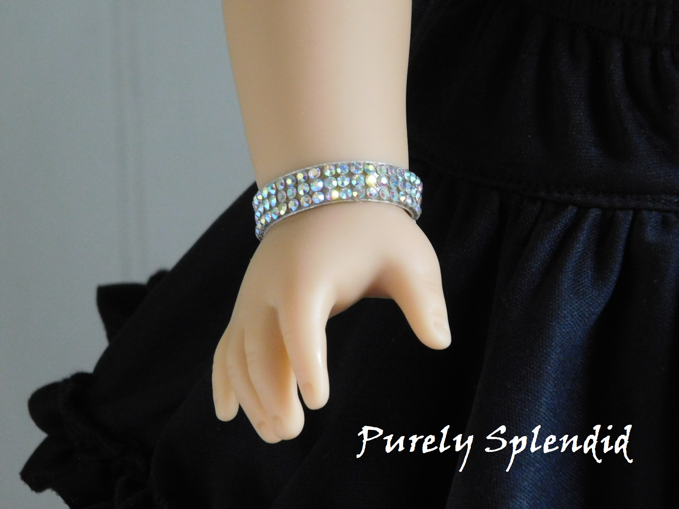 18 inch doll shown wearing the Sparkling Aurora Borealis Bracelet