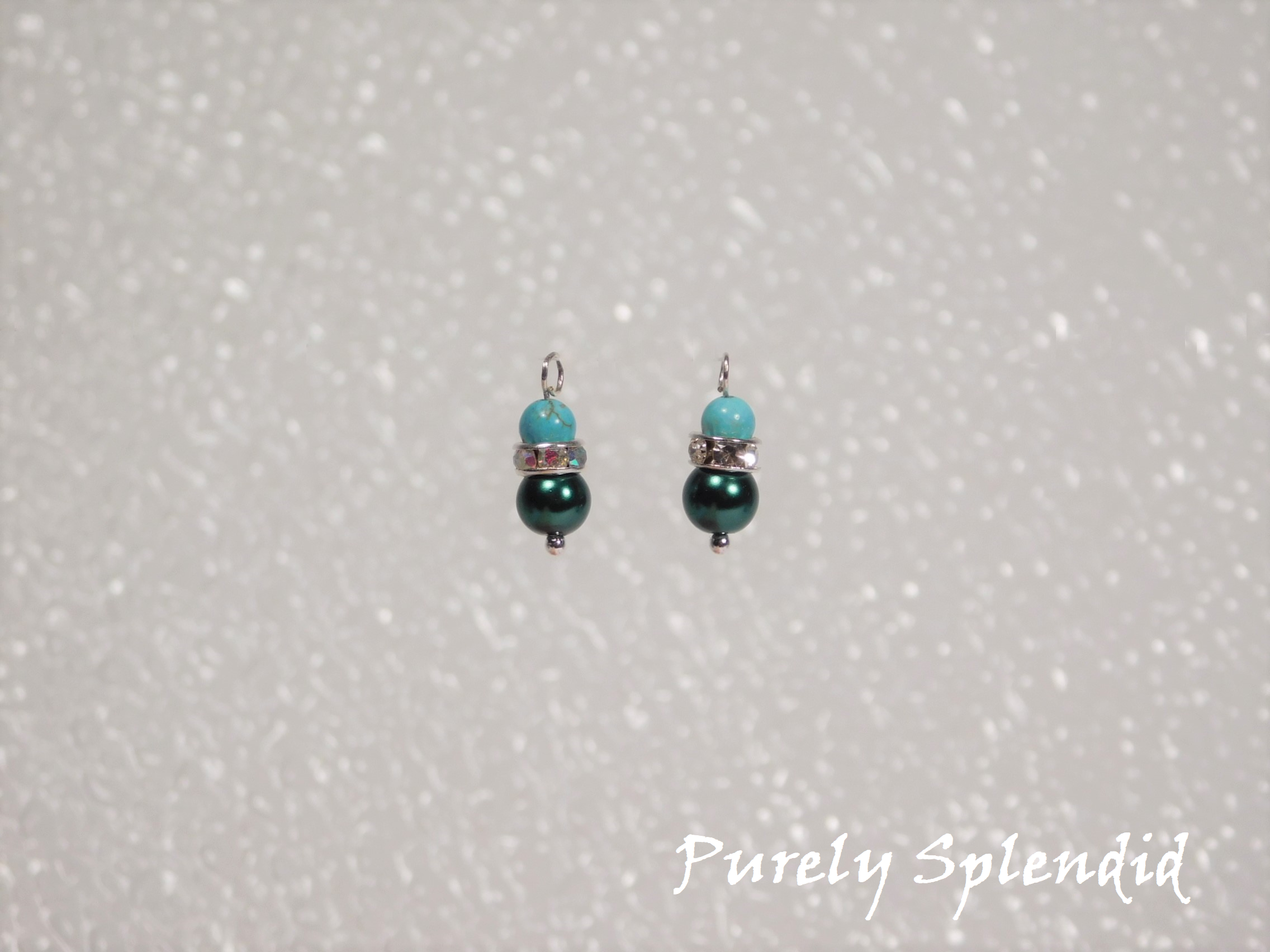 Teal glass pearl bead topped with a ring of sparkling silver and a unique round turquoise stone bead