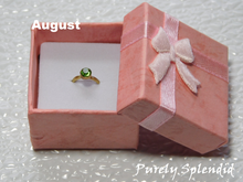 Load image into Gallery viewer, August Birthstone Ring for 18 inch dolls - peridot colored crystal on a gold band
