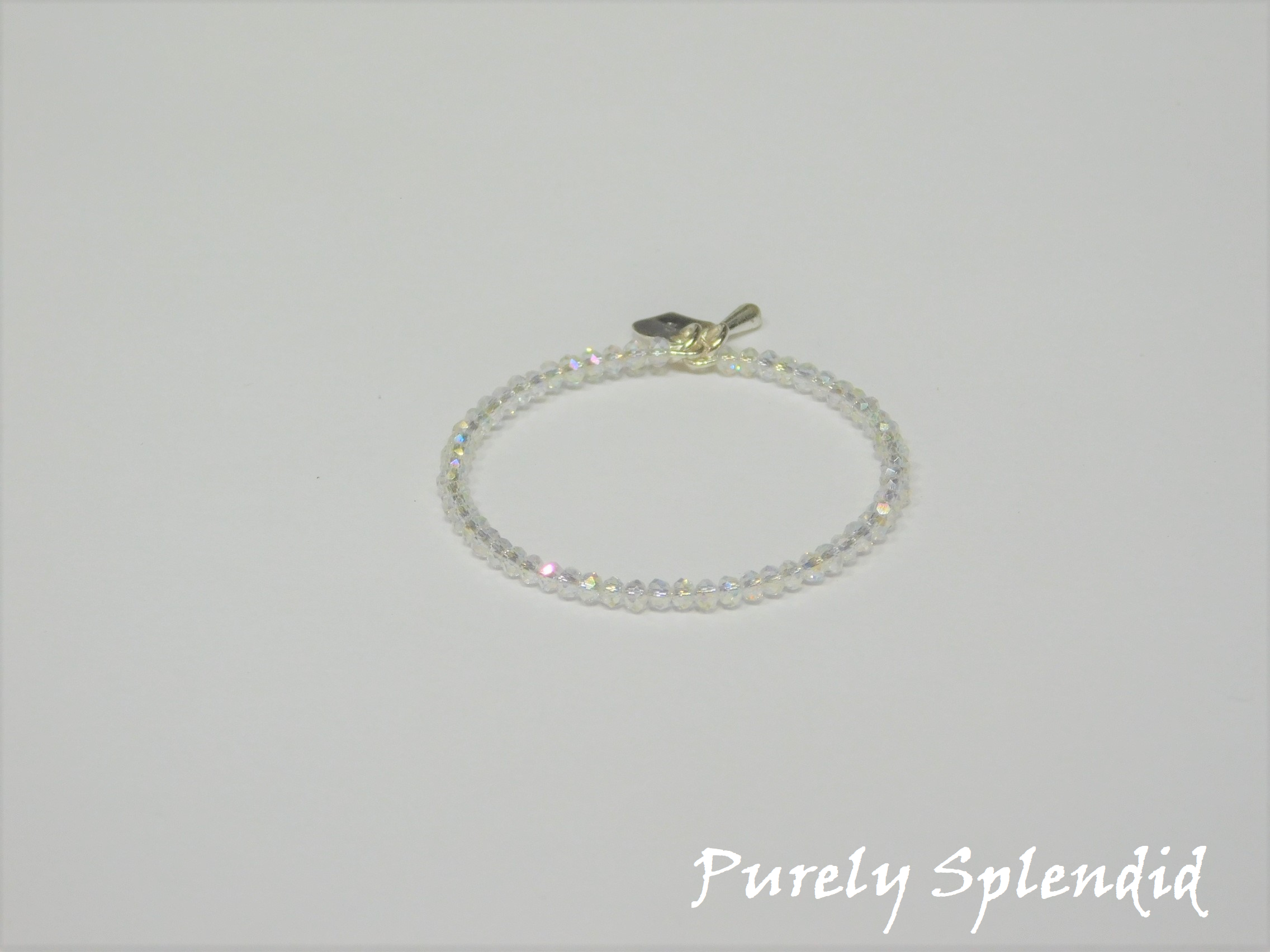 Small Aurora Borealis crystal beads make up this beautiful doll bracelet