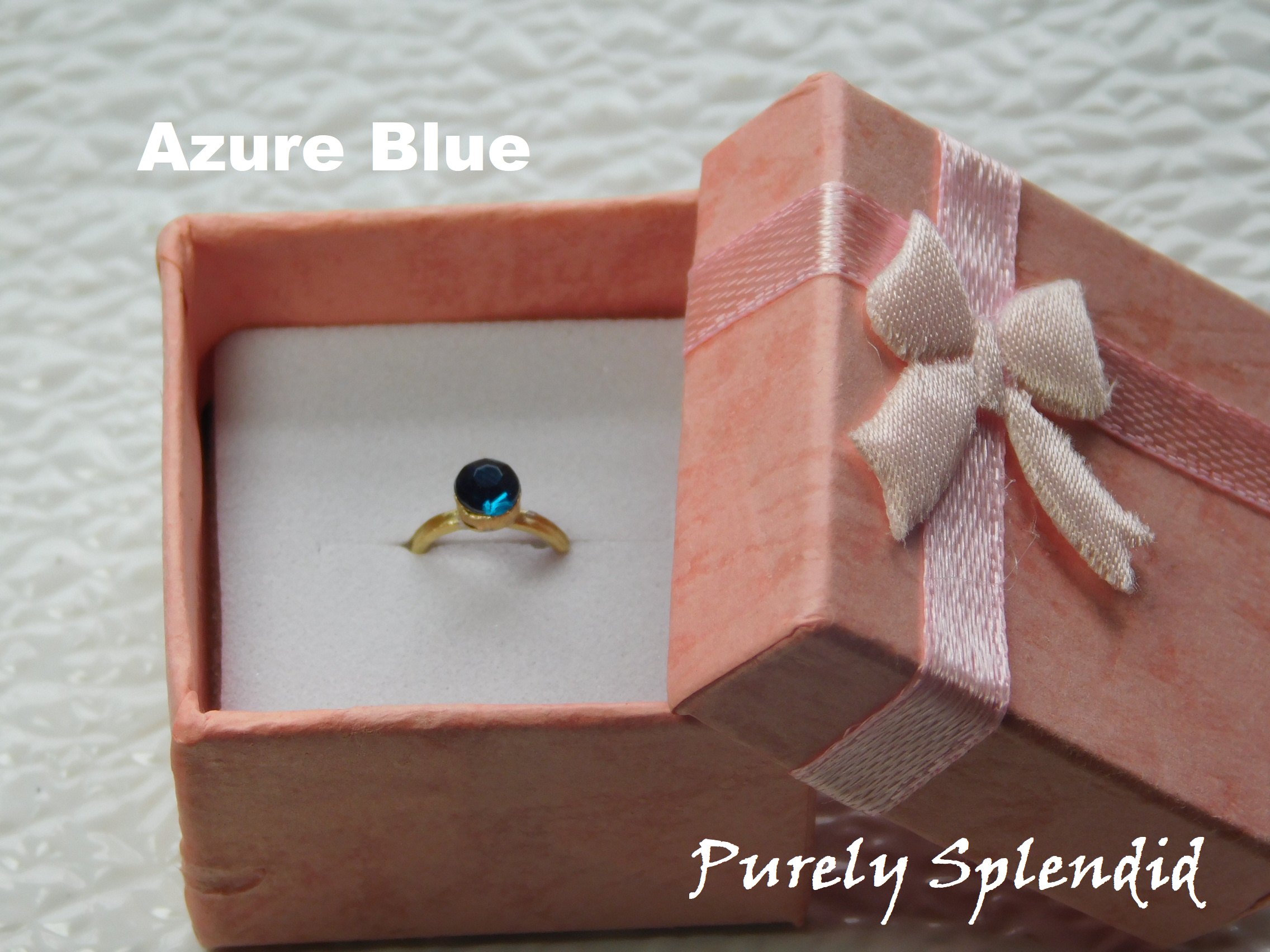 Azure Blue colored crystal on a gold band