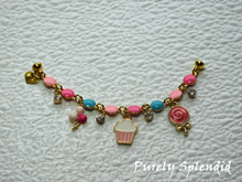 Load image into Gallery viewer, Birthday Charm Bracelet features a festive bracelet of pink and blue with cute balloons, cupcake, candy and sparkling charms. Closes with a magnetic clasp
