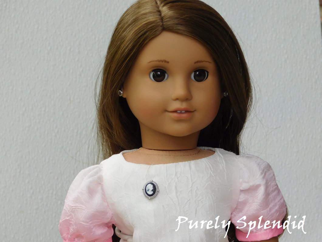 18 inch doll shown wearing the Silver and Black Cameo Brooch