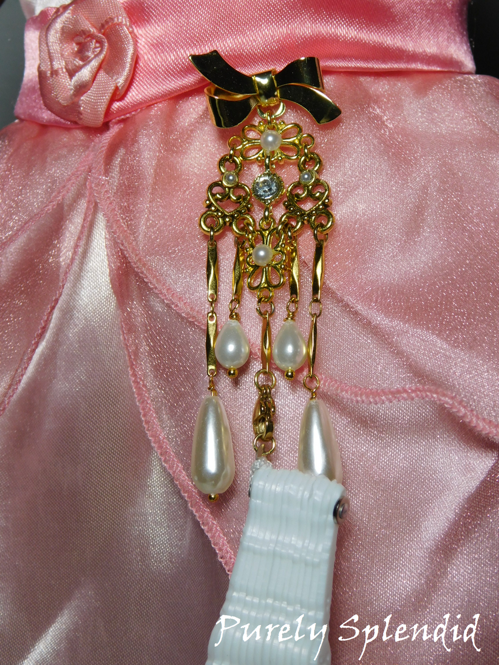 Fancy Gold Chatelaine with a White Lacy Hand Fan 