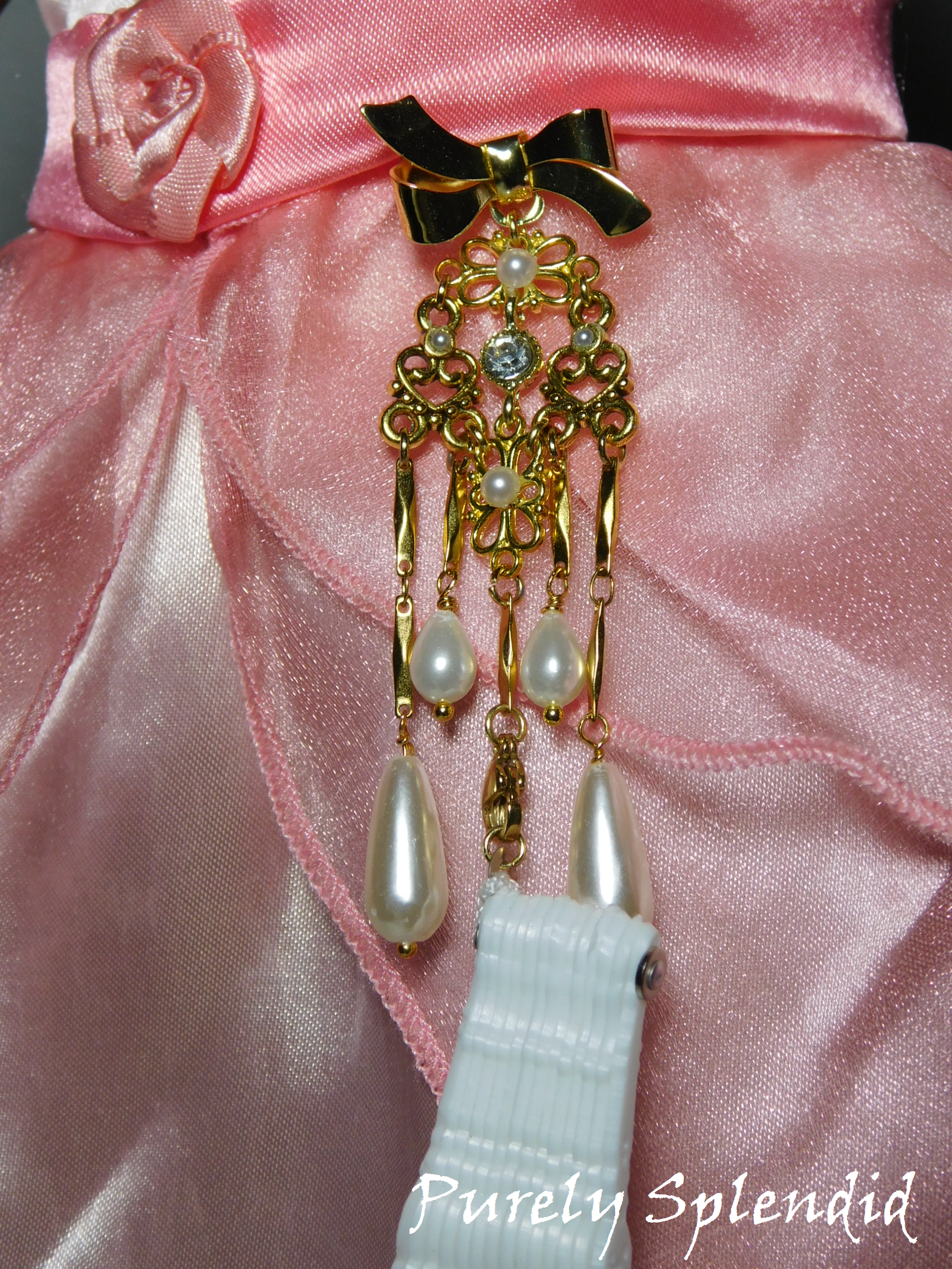 Fancy Gold Chatelaine with a White Lacy Hand Fan 