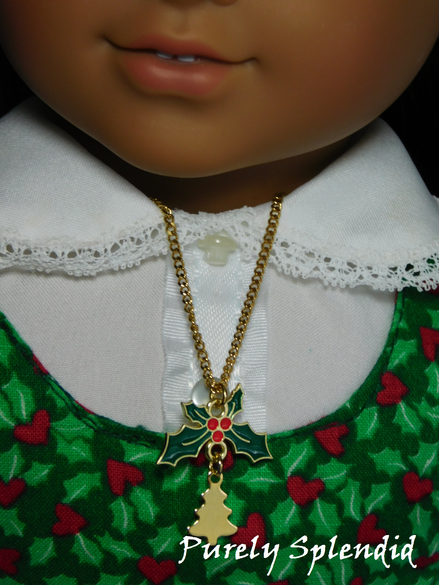 doll necklace - sprig of holly with a gold Christmas Tree hanging below it