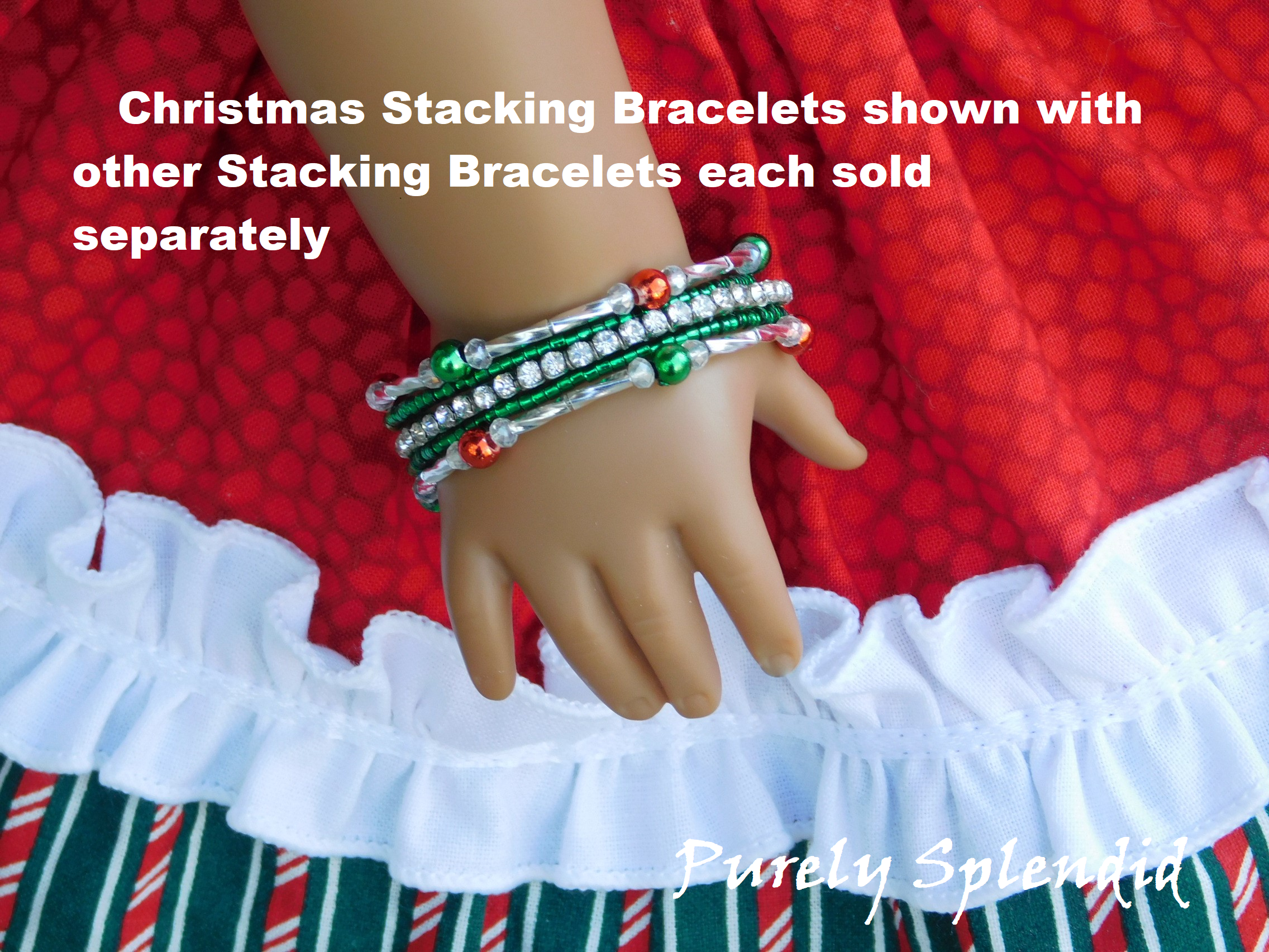 group of stacking bracelets for 18 inch dolls - two bracelets of red and green metallic beads alternating with long twisted silver beads and  two bracelets of matching green and one bracelet of sparkling rhinestones