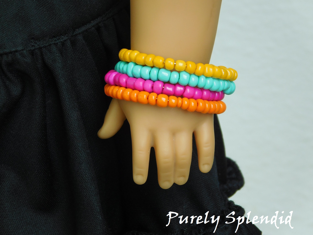 18 inch doll shown wearing 4 Chunky Stacking Bracelets in Sunny Yellow, Totally Teal, Hot Pink and Perfect Pumpkin