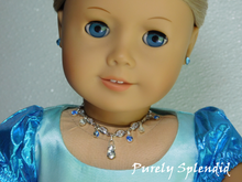 Load image into Gallery viewer, Sparkling crystal necklace with alternating blue and clear crystal dangling from the main necklace along with a large teardrop crystal as the center dangle shown worn by an 18 inch doll
