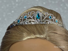 Load image into Gallery viewer, Silver filigree crown with sparkling blue accents worn by an 18 inch doll
