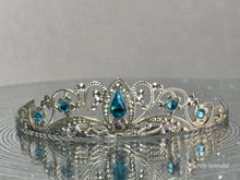 Load image into Gallery viewer, Silver filigree crown with sparkling blue accents
