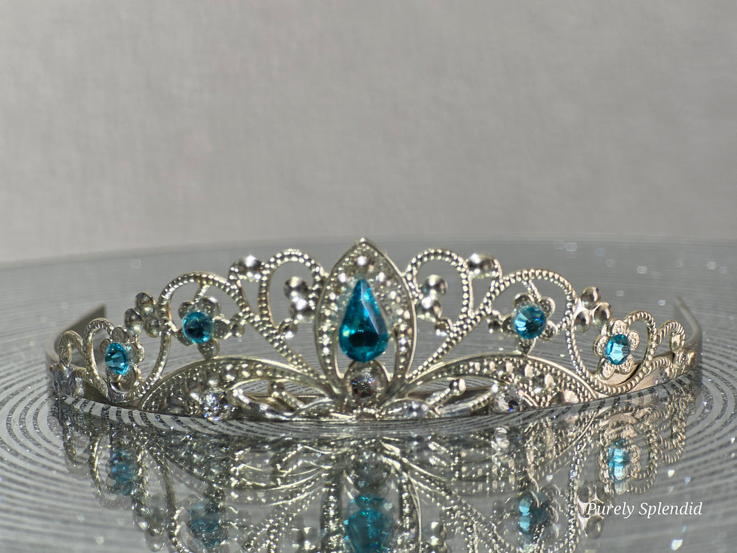 Silver filigree crown with sparkling blue accents