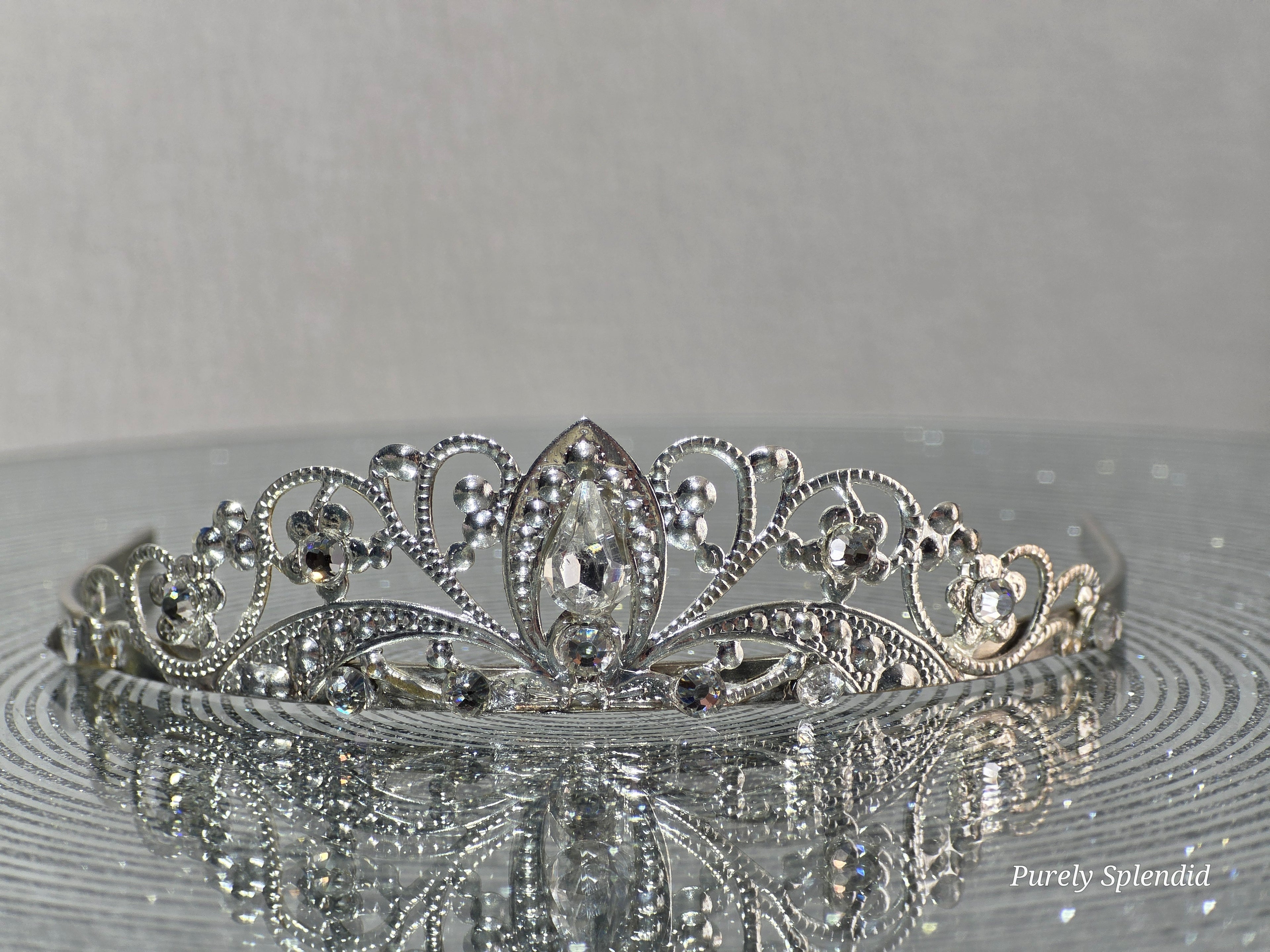 Silver filigree crown with sparkling crystals