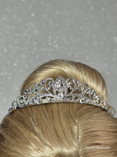 Load image into Gallery viewer, Silver filigree crown with sparkling crystals worn by an 18 inch doll

