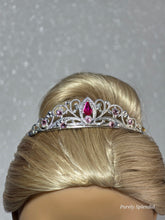 Load image into Gallery viewer, Silver filigree crown with sparkling pink crystals worn by an 18 inch doll
