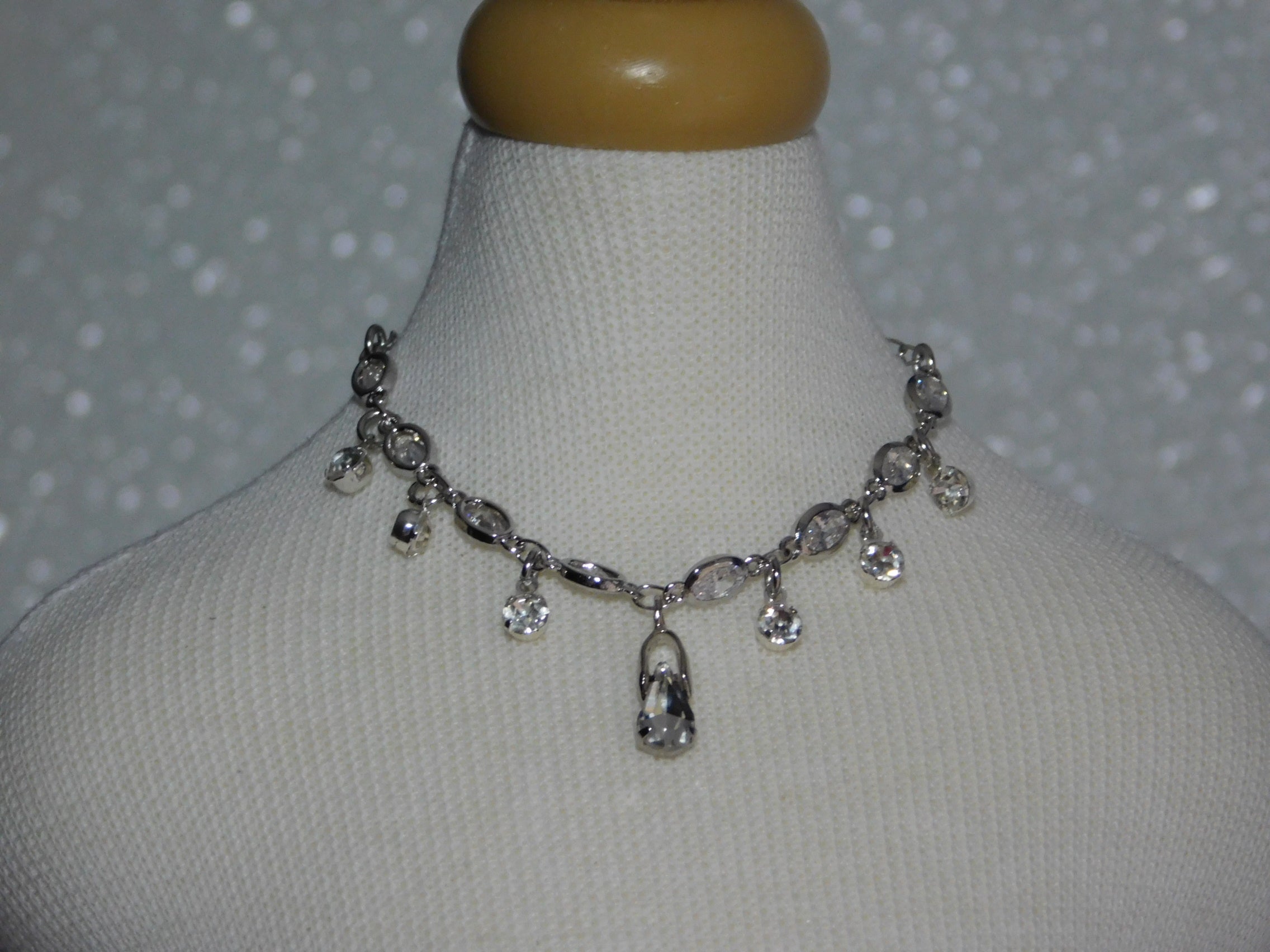 crystal necklace with crystal dangles and a large crystal teardrop center dangle

