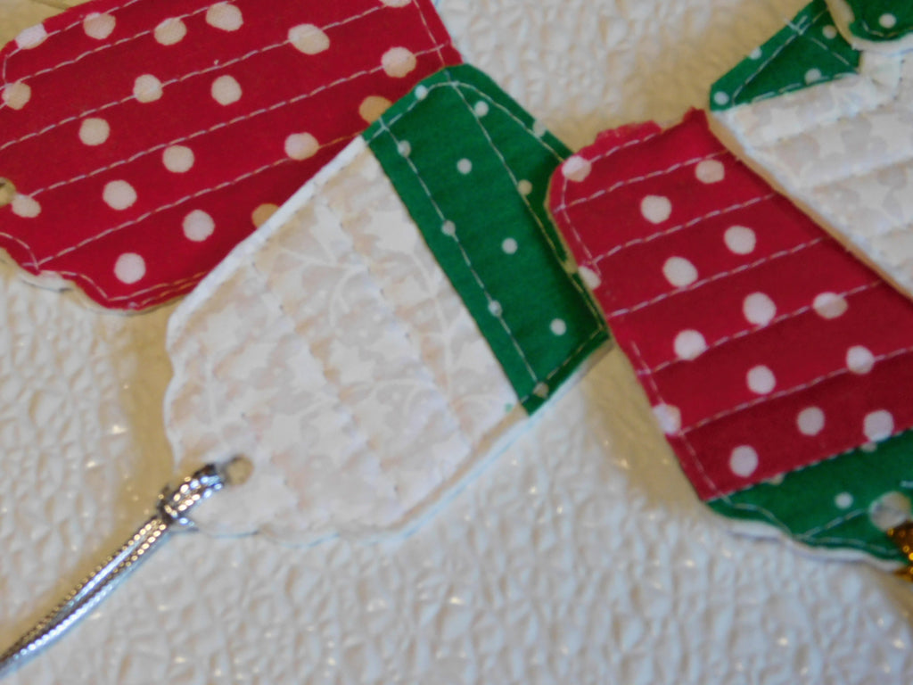 quilted gift tags in red with white dots, green with white dots and a white on whit floral