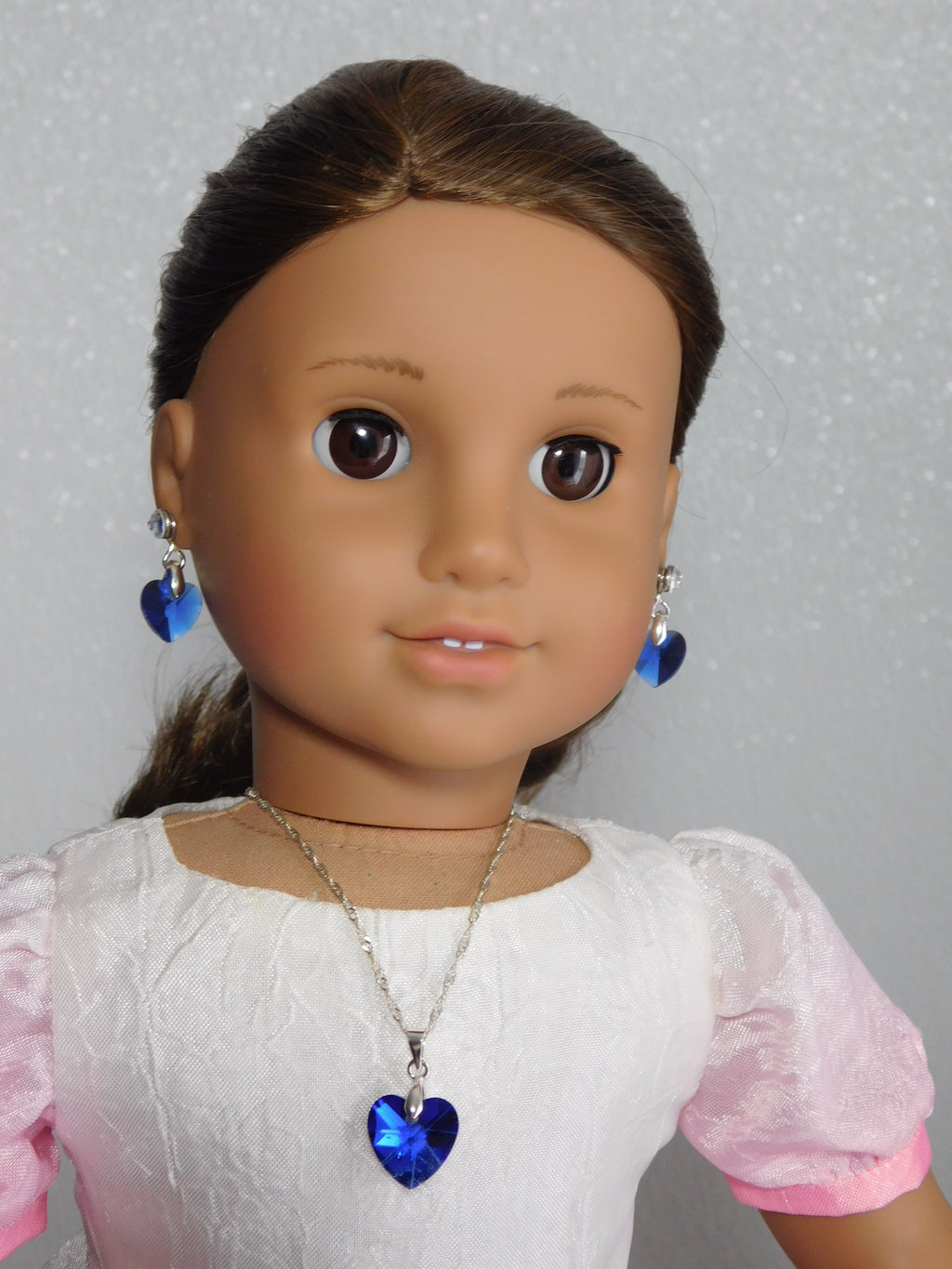 18 inch doll wearing a blue Crystal Heart Pendant Necklace and Earrings