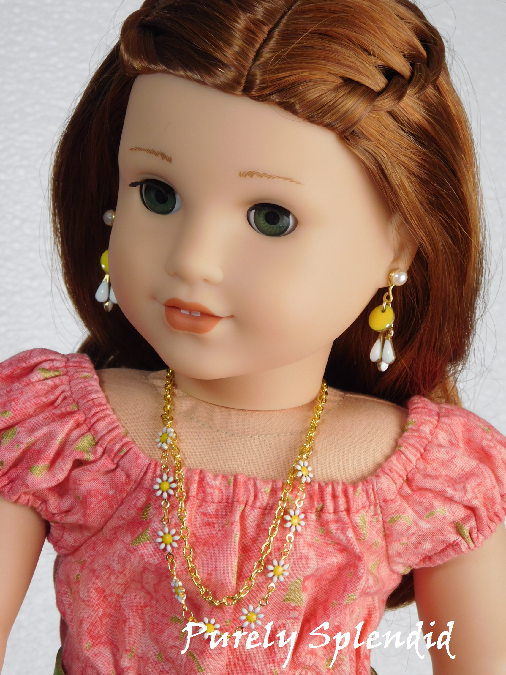 18 inch doll modeling Daisy Dangle Earrings with Pearl Studs and Daisy Necklace featuring 9 tiny daisy flowers on a chain and a 2nd plain gold chain