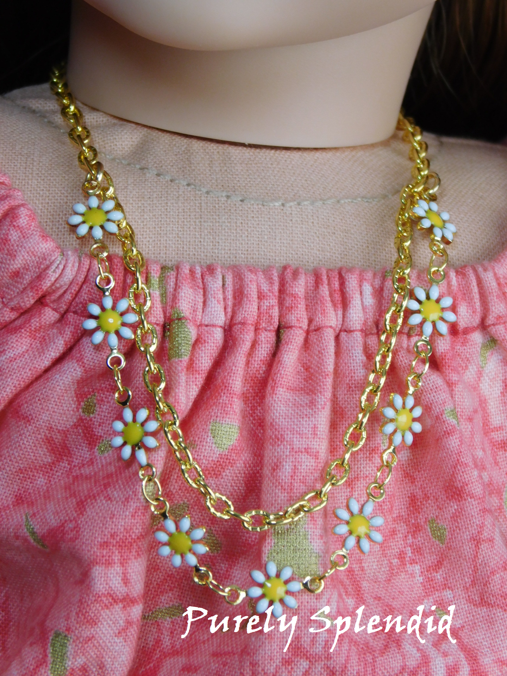 double chain necklace with 9 dainty daisy flowers and a plain gold chain 