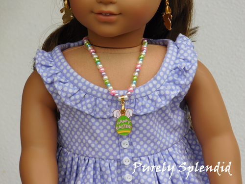 18 inch doll shown wearing the Easter Pearl Necklace with Easter Egg center pendant