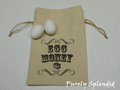 Canvas drawstring bag with "Egg Money $" on the front
