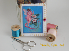 Load image into Gallery viewer, cute pink fairy sewing a flower on the front cover of the Fairy Needle Book

