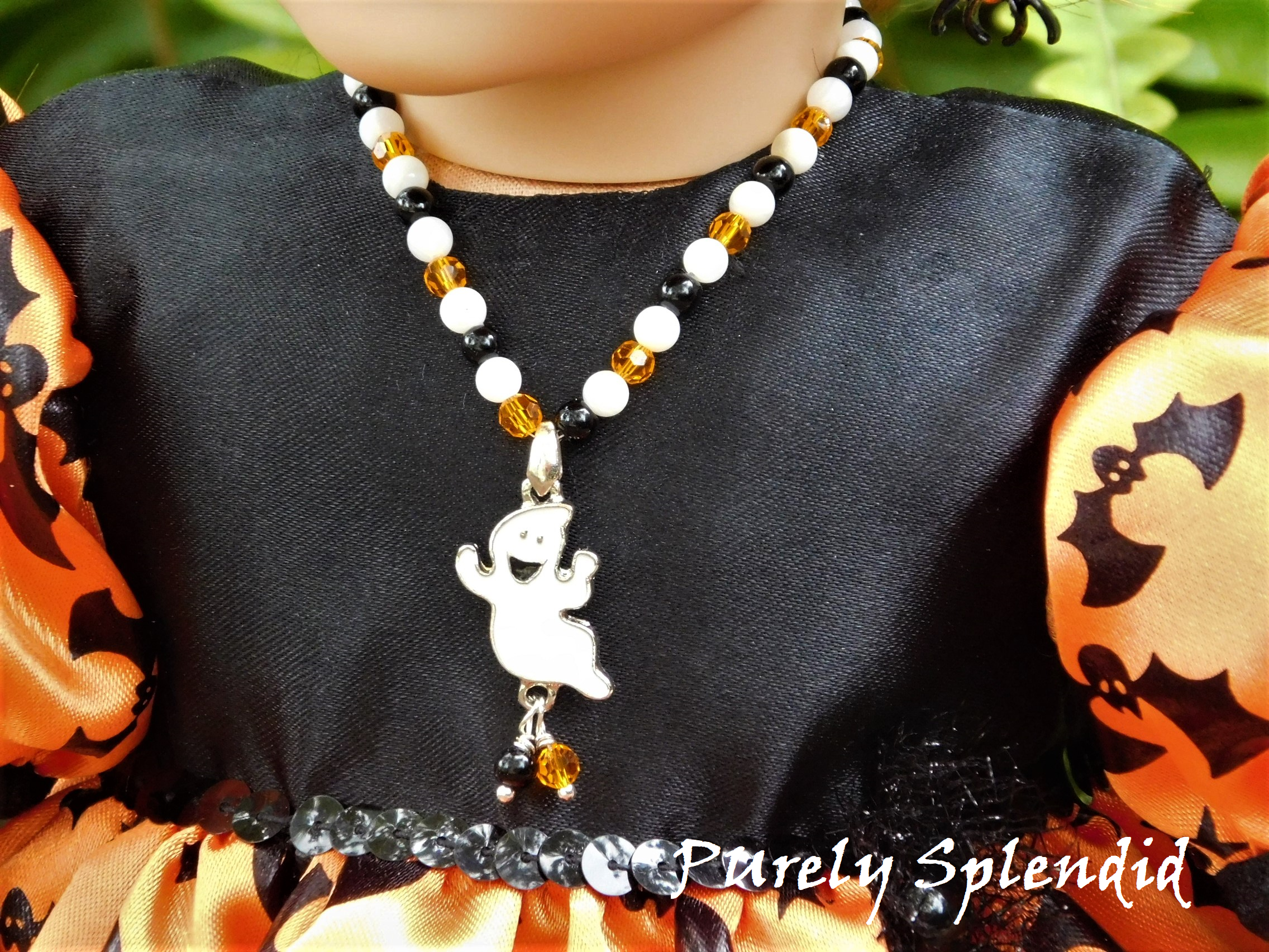 18 inch doll shown wearing Ghost Necklace