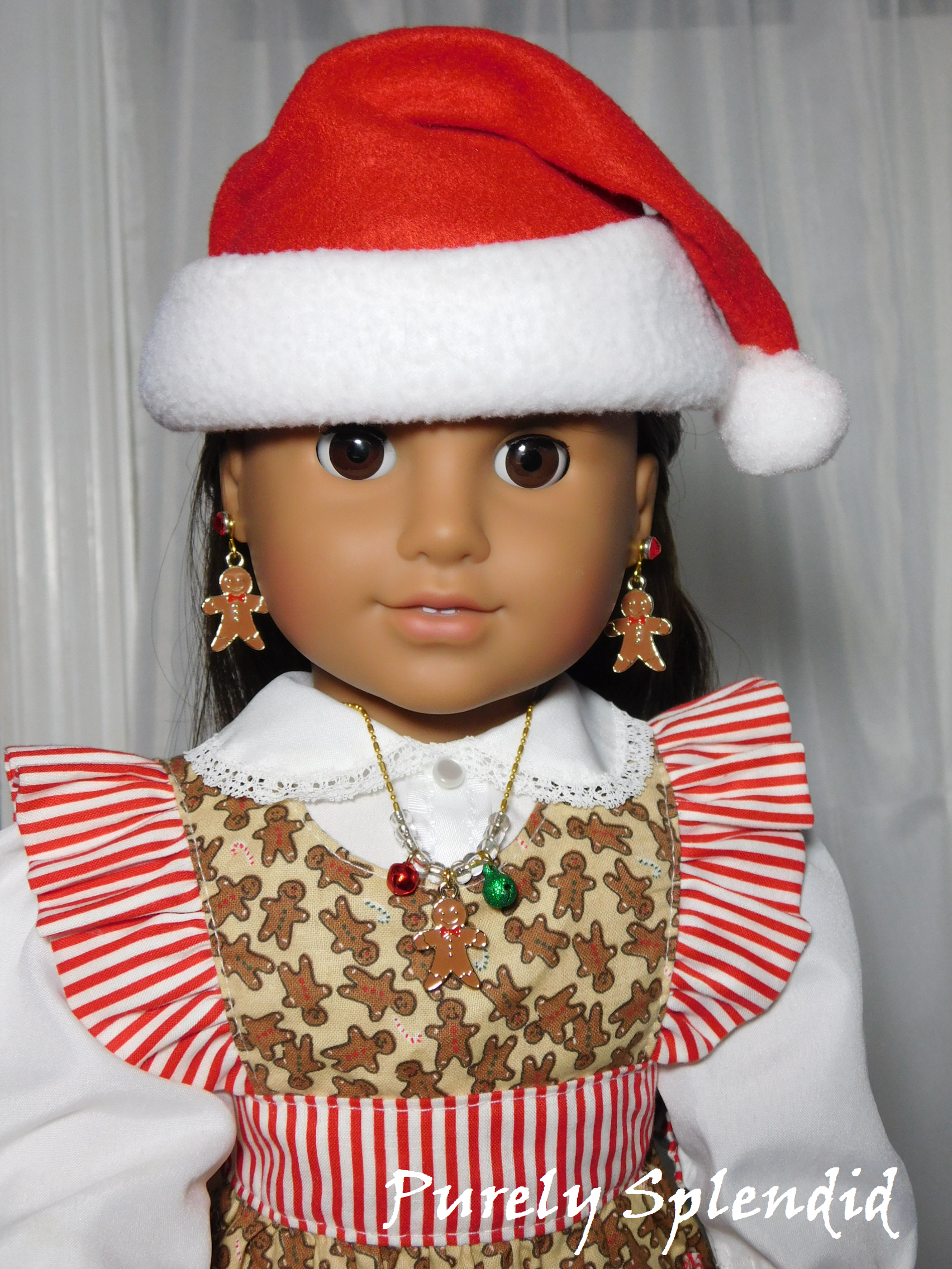 18 inch doll wearing a gingerbread man necklace with red and green jingle bells