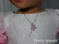 Pink glittery star wand necklace worn by an 18 inch doll