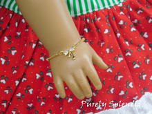Load image into Gallery viewer, Cubic Zirconia Gold Bow on a simple gold chain- shown on an 18 inch doll
