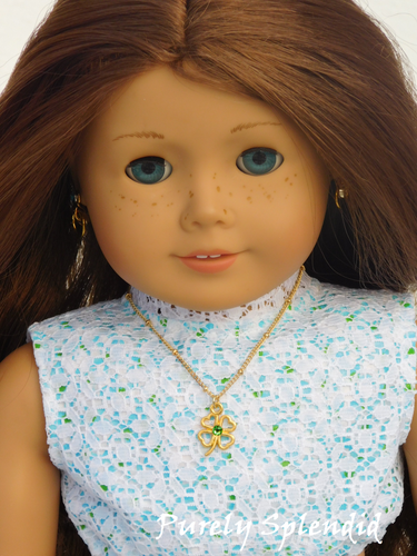 18 inch doll shown wearing  a Gold Shamrock Necklace which has a sparkling green center stone